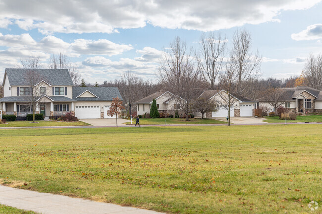 A row of homes in Buscher Park overlooking the large green space at the park in Mankato, MN.