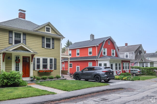 Rows of brightly colored homes line the charming streets of the Beverly Farms neighborhood, creating a welcoming atmosphere.