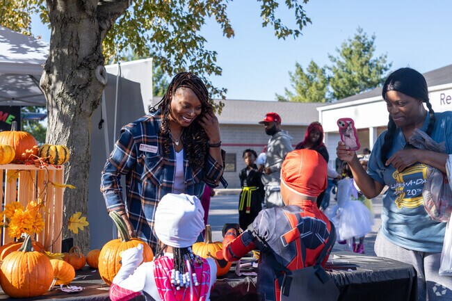 Residents volunteer to work booths at Fall Fest near Black Jack.