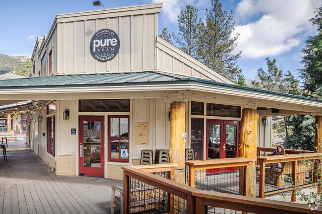 Sit outside and enjoy a coffee on the deck at Pure Bean near Pine Cove.