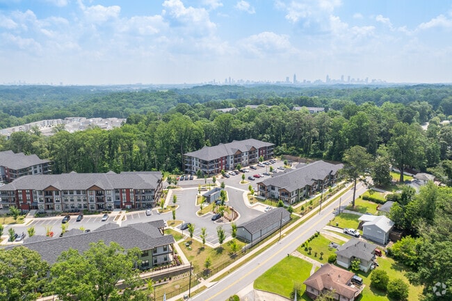 Monroe Heights reveals a mix of new construction and dense greenery, showcasing its growth alongside preserved natural beauty.