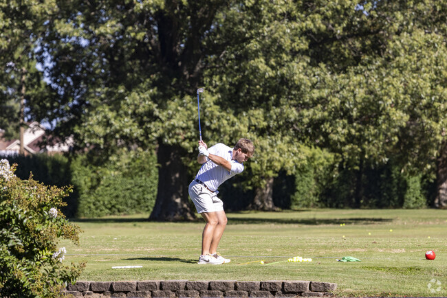 A man practices his swing at Owensboro Country Club near Masonville.