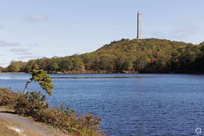 High Point Monument rises above Lake Marcia in High Point State Park.