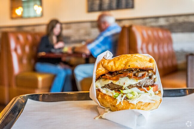Famous Burgers and Brew are notorious for the Cowboy Burger in Capital Village.