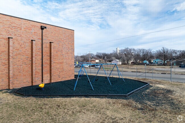 There is a small swing set for kids to enjoy at Irving Elementary School.