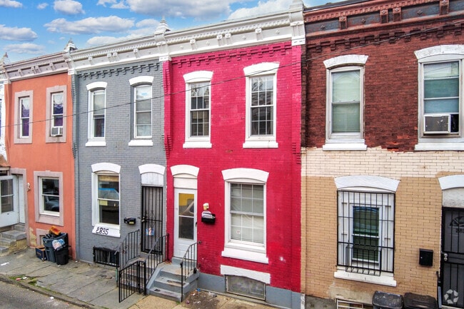 Colorful homes in the McGuire neighborhood stand out from the rest.