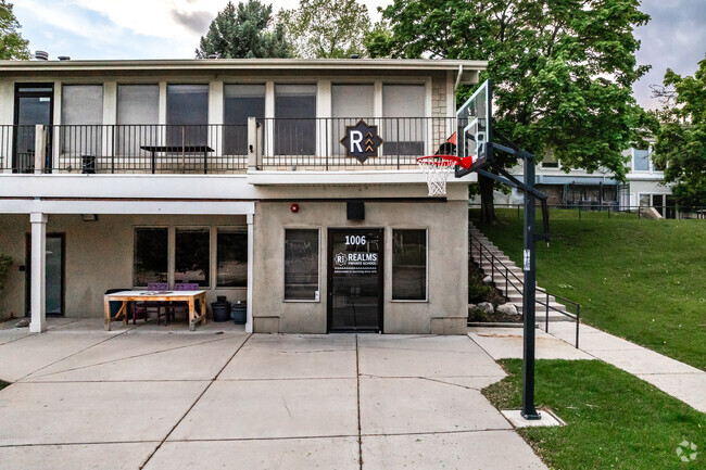 Outdoor tables provide space for students to work outside at Realms of Inquiry.