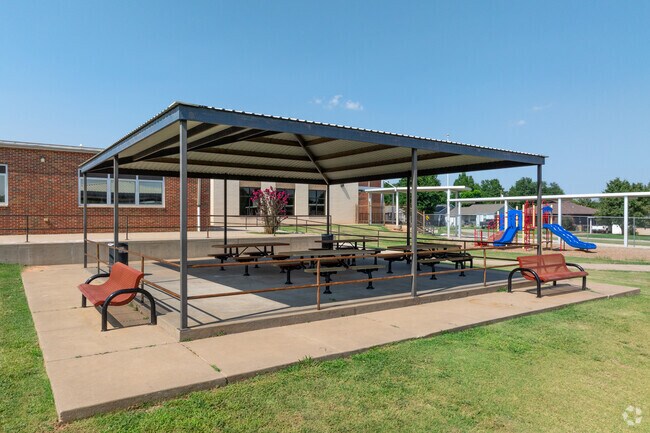 Hillcrest Elementary School has shady spots for the kids sit and socialize.