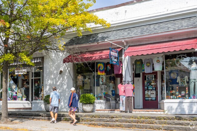 Exterior view of residents walking by Woodstock Blues