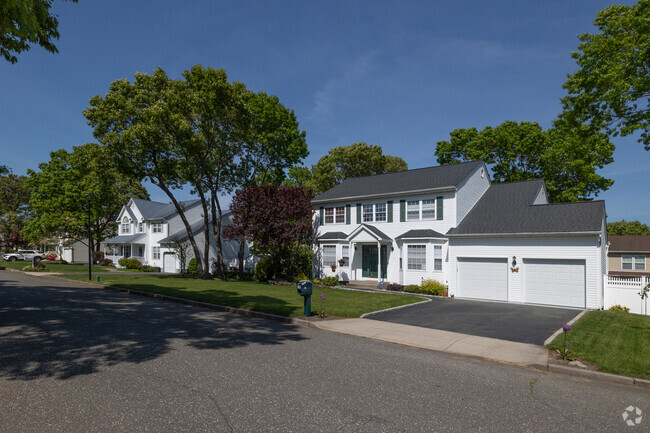 Colonial Revival style homes in Holtsville are often found with well manicured yards.