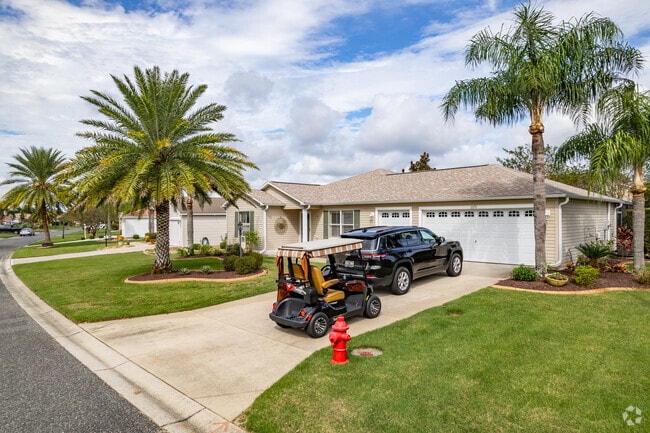 A beautiful row of homes with room for golf carts in the The Village of Duval.