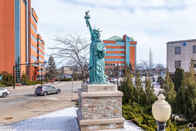 A small replica of the Statue of Liberty stands over downtown Neenah.