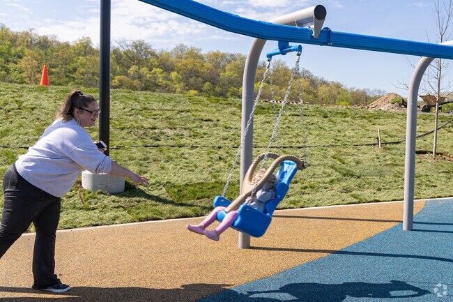 Families enjoy days outside at the newly built Riverfront Park in Miamisburg.