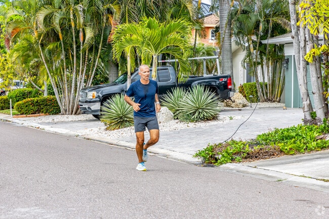 Residents jog around the beautiful Causeway Isles neighborhood in Saint Petersburg.