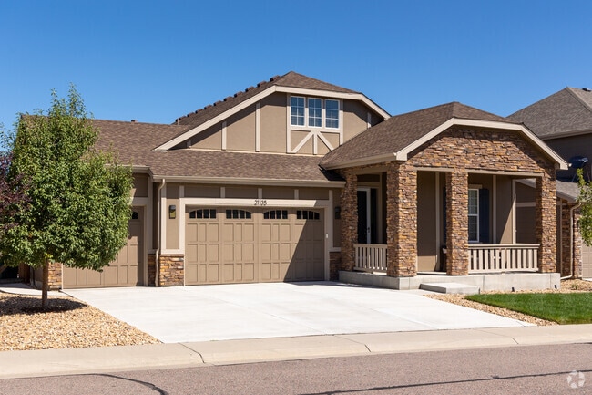 Dutch Revival-style homes in Copperleaf feature impressive stonework.