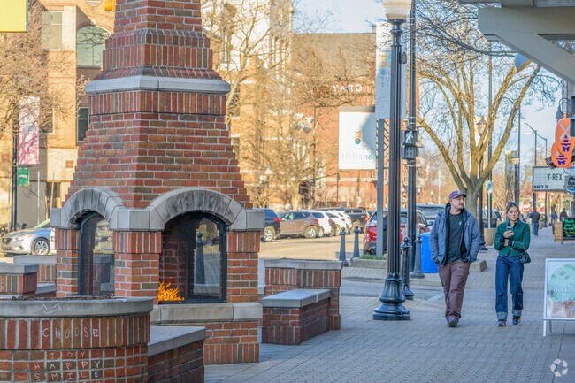 A couple enjoys the various shops in Downtown Holland, near the Historic District.