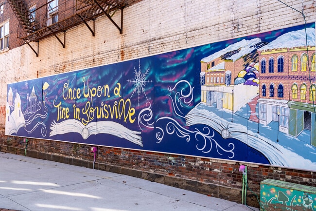 Colorful mural art decorates Umbrella Alley in downtown Louisville Ohio.