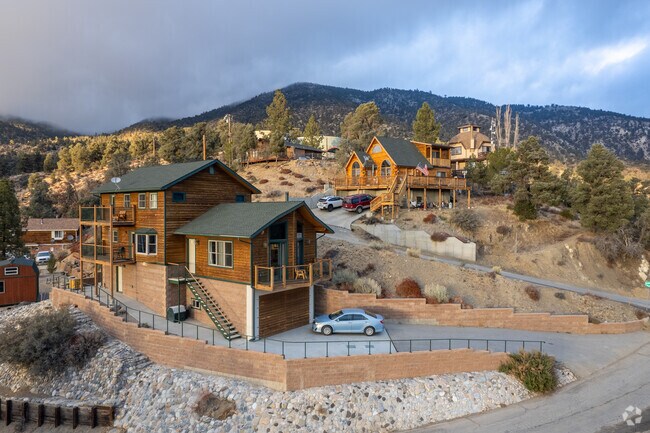 Homes perched on a ridge, offering breathtaking valley views in Lake of the Woods.
