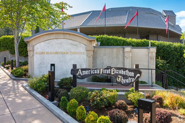 A wooden sign is featured at the entrance to the Shakespeare Festival near Mountain Meadows.