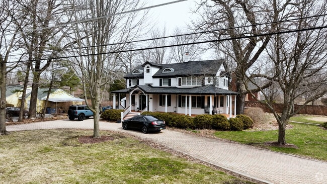 The residential areas in Navajo Hills are lined with large trees.