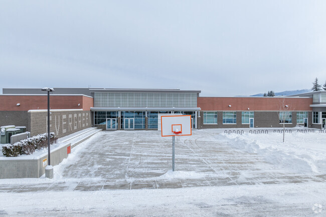 Evergreen Middle School features several basketball courts behind the school.