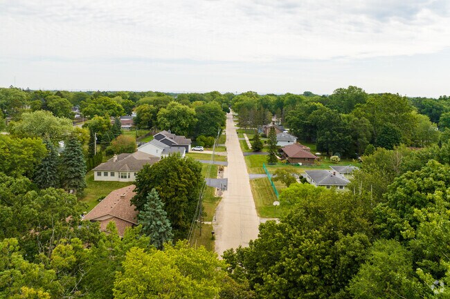 A neighborhood surrounded by trees and foliage in Zion, IL.