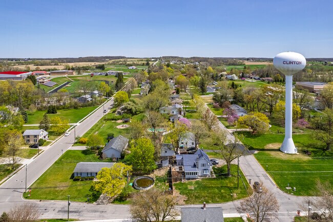 Clinton water tower rises above Clinton's residential streets, visible throughout the town.