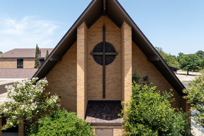 The cross and stained glass window adorn the welcoming entrance of Pathway Christian Academy.