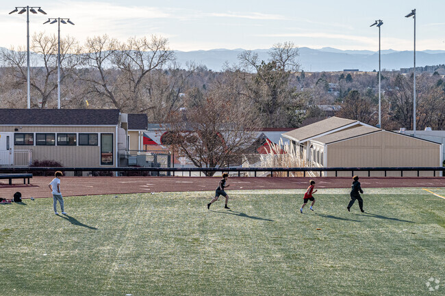 Children enjoy playing sports on the football field at Rangeview High School in Aurora.
