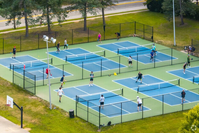 Founders Grove residents can play pickleball at the nearby Ewing Park courts.