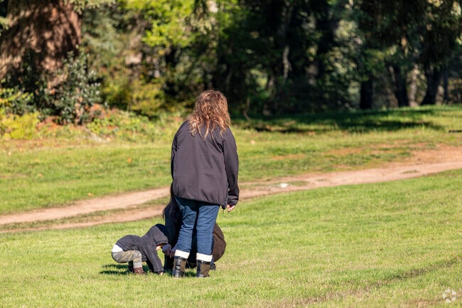 A family walk and talk in Gateway Park.