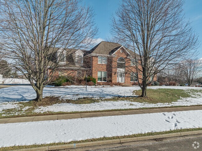 A modern brick colonial inspired house with traditional dormers is typical of the newer homes in Ashland.