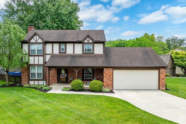 A Tudor style home in Summerwood features a well-manicured lawn.