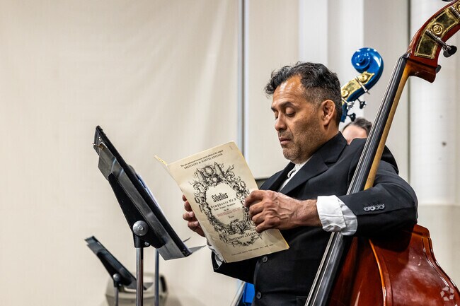 A musician checks his music at Utah Cultural Celebration Center in Redwood.