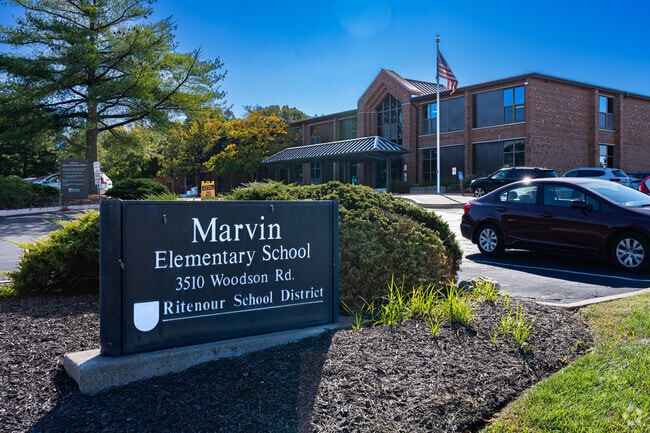 An American flag waves at the entrance to Marvin Elementary School.