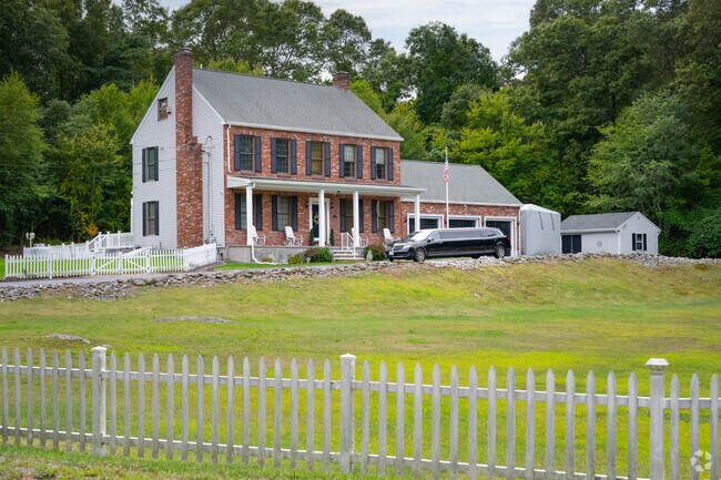 This brick Colonial Revival home in Rehoboth features unique architectural details.