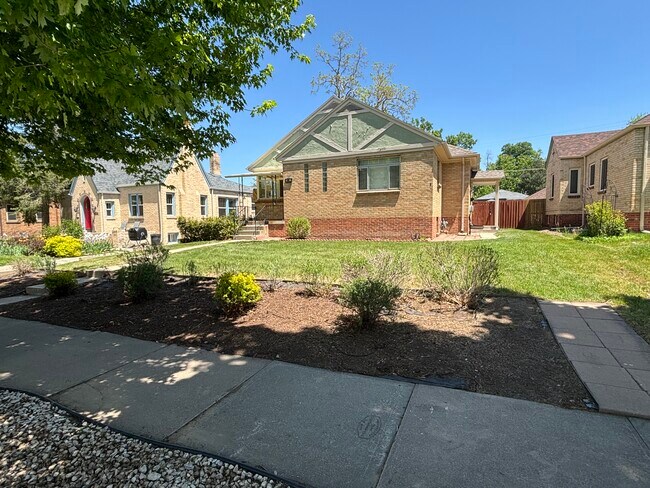 Class brick bungalow on tree-lined street