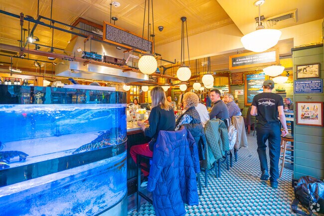 Sit at the bar next to the lobstar tank at Turner's Seafood Grill & Market in Melrose.