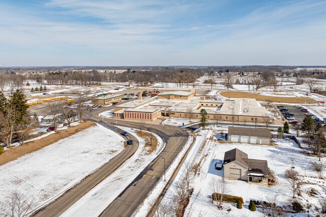 A looping drive makes pickups and drop-offs at School name easy.