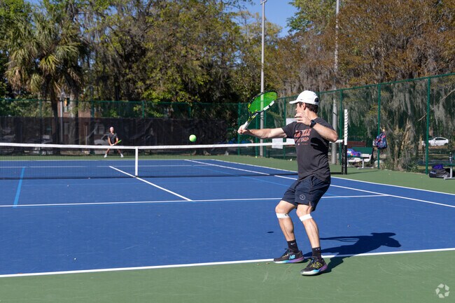 Neighbors and friends gather at Daffin Park for a round of tennis.‎ ‎ ‎ ‎ ‎