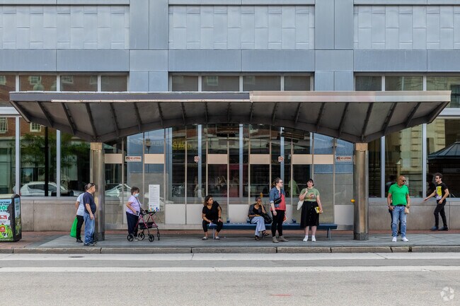 Residents gather to catch the next bus in South End.