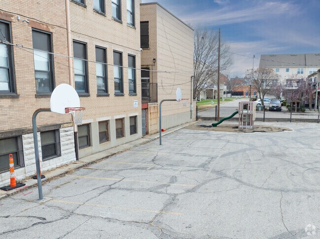 Students enjoy playing basketball on the court during recess.