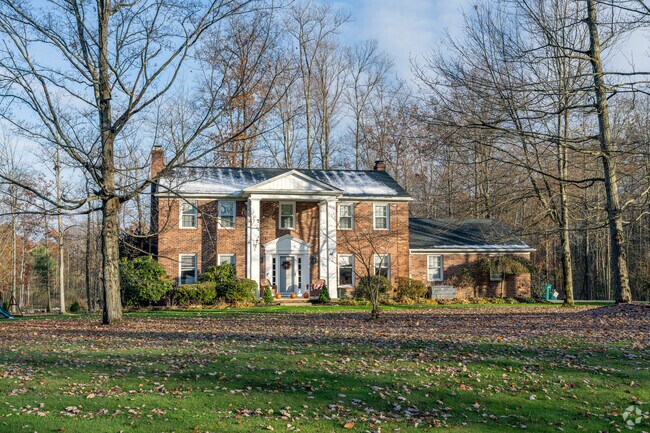 Colonial-inspired homes sit on wooded lots throughout Bainbridge.