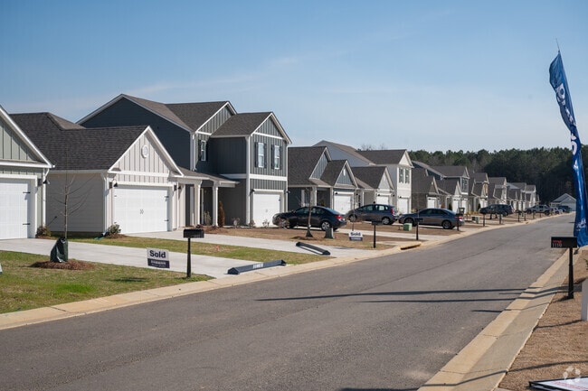 Odneville homes have wide streets and flat front yards.