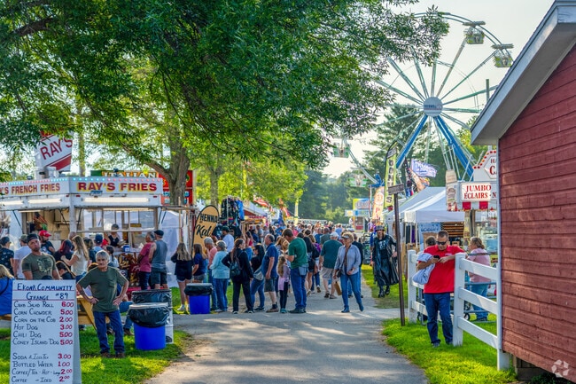 Crowds line up for fried dough at the Brooklyn Fair near Hampton, a countywide summer draw.