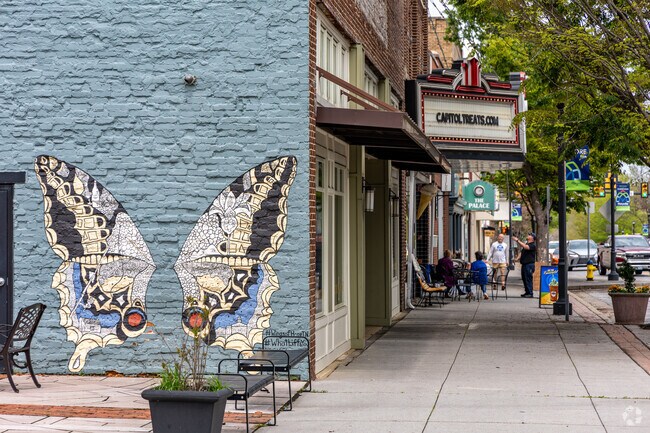 Take a photo in front of the butterfly wings mural by artist Kelsey Montague in downtown Maryville.