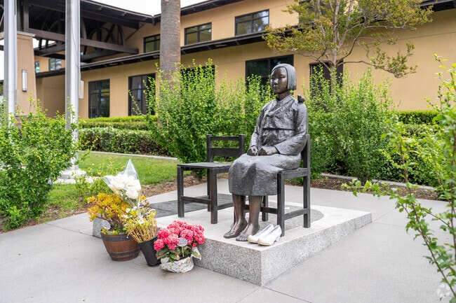 The Comfort Women Peace Monument in Glendale features a bronze statue of a young girl symbolizing the thousands of women forced into sexual slavery during World War II.