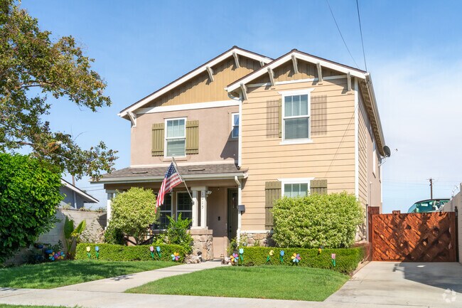 Logan offers a charming two-story home with cozy living spaces and a welcoming porch.