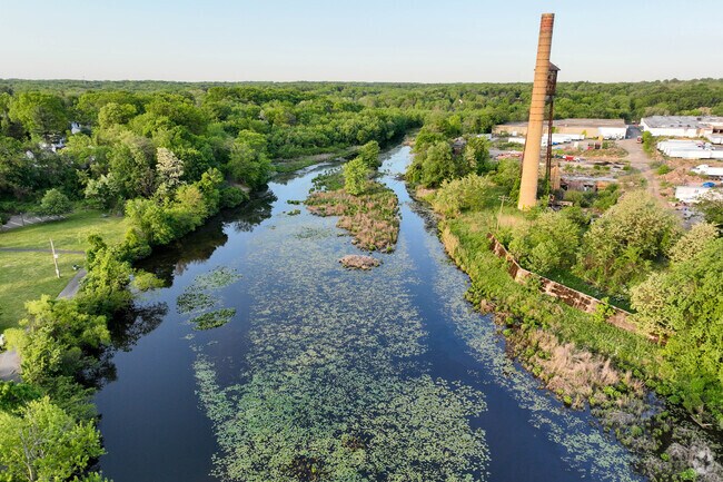 Milltown's Pond Park features a body of water surrounded by a walking trail in Milltown, NJ.