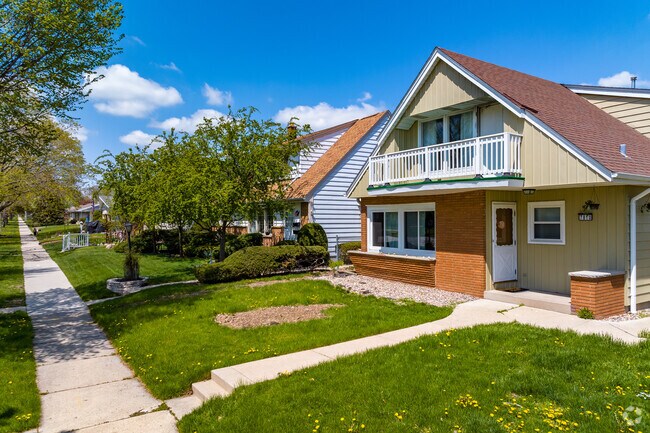A view down a neighborhood sidewalk the Rolling Green neighborhood.